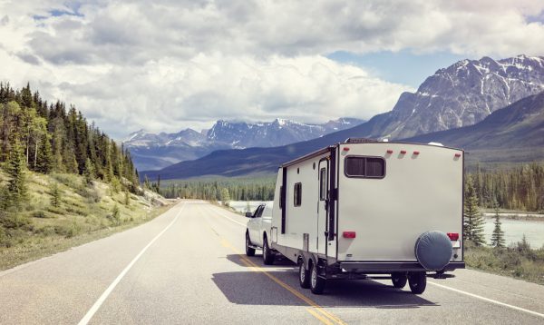 Caravan Or Motor Home Trailer On A Mountain Road